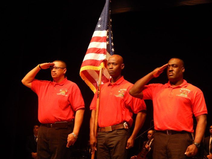 Member of the Halefo Color Guard salute during the Star-Spangled Banner.