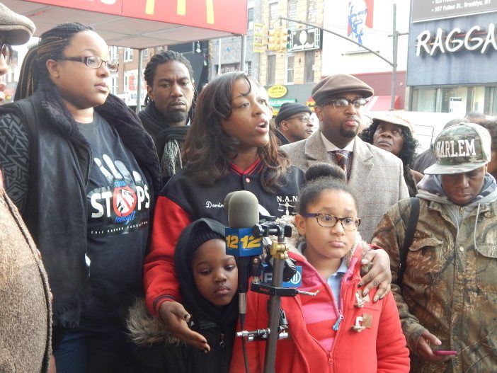 Dominique Sharpton, center, at microphone