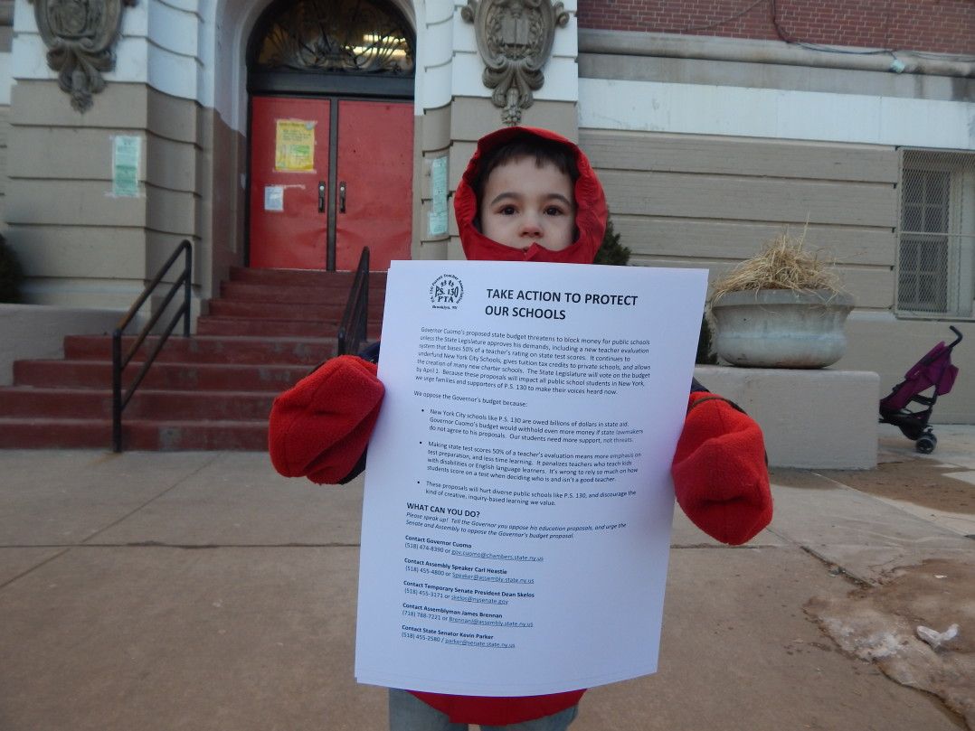 PS 130 student Django Spadola, 7, protested outside his school.