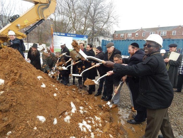 PS:IS 338 groundbreaking shoveling dirt