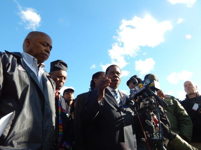 Councilman Mathieu Eugene, at microphone, denounced Monday night's violence at today's press conference.