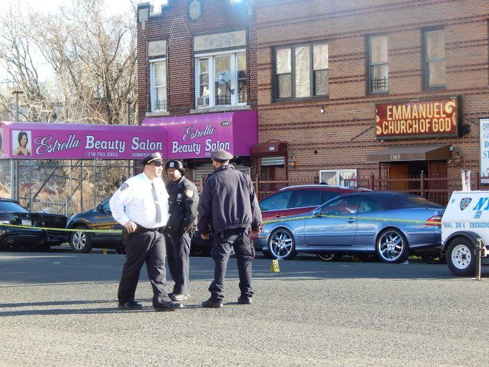 Police stand outside the Emmanuel Church of God on Flatbush Avenue Tuesday morning.