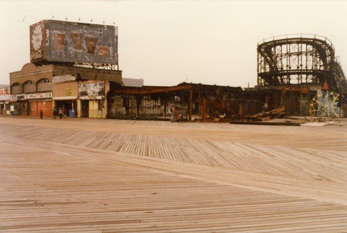 Coney Island's boardwalk has evolved quite a bit over the years. This is during some of is toughest times. Photo by Abe Feinstein.