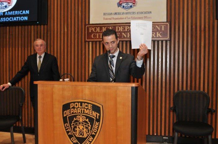 RAOA President Belogorodsky holds up NYPD Commissioner Bill Bratton's official stamp of approval. (Source: RAOA)