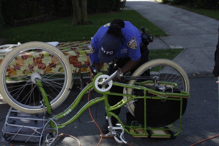 A 70th Precinct officer registers a bicycle in our neighborhood. Photo by Nathan Thompson