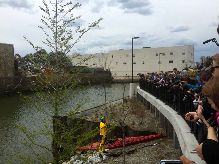 Reporters ask Swain about the swim after he emerges from the water.