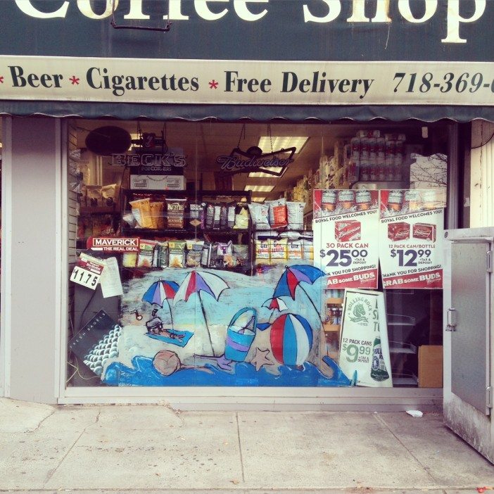 beach scene painted on a bodega window in south slope