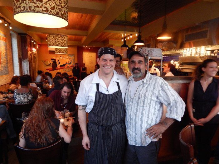 Bashi Channel owners David Pitula and Jim Mamary celebrate their restaurant's soft opening Tuesday evening.