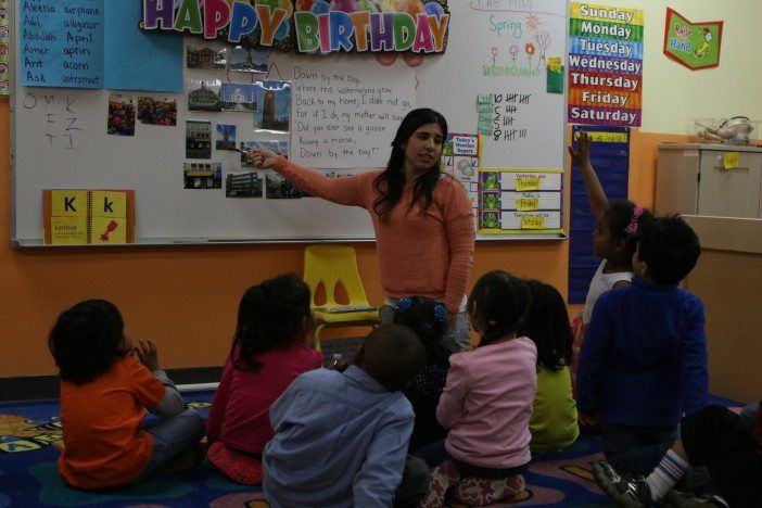 Students and their teacher at the COPO pre-school.