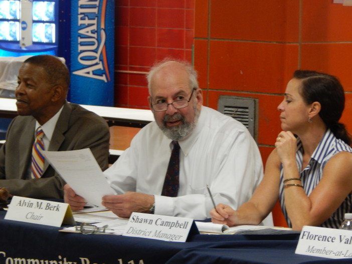 Community Board 14 Vice-Chairman Ed Powell, left, Chairman Alvin Berk, and District Manager Shawn Campbell at Monday's meeting.