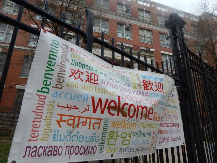 PS 217's sign welcomes neighbors with many of the languages spoken by the school's students.