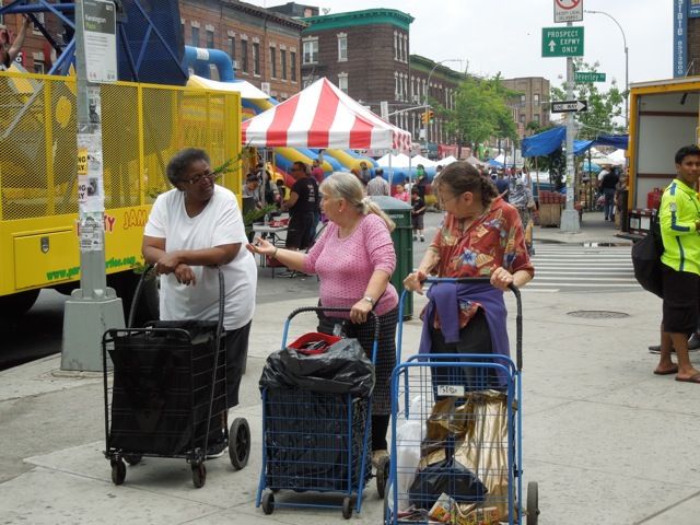 At Kensington Plaza. CArt ladies and the rides.