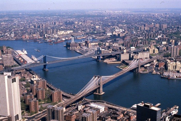 Two of the three East River crossings, circa 1981. Source: Wikipedia