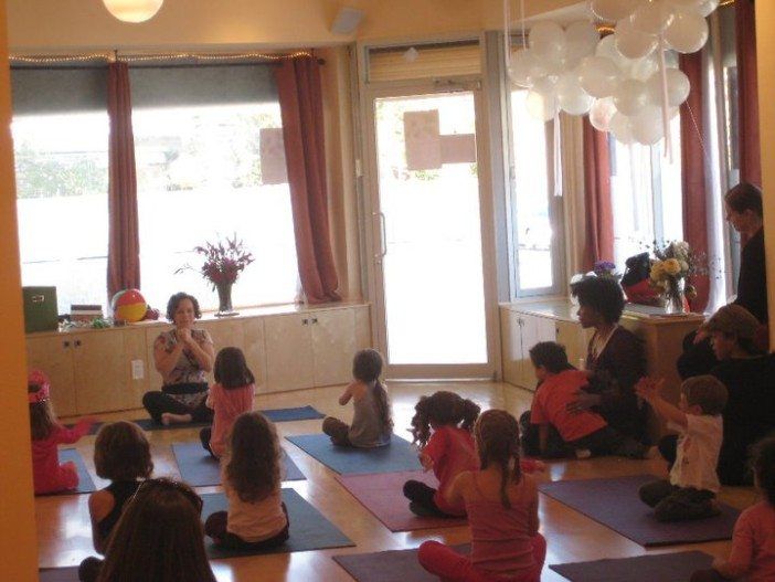 Kids practicing in the Jaya Yoga East space. (Photo via Jaya Yoga Center)