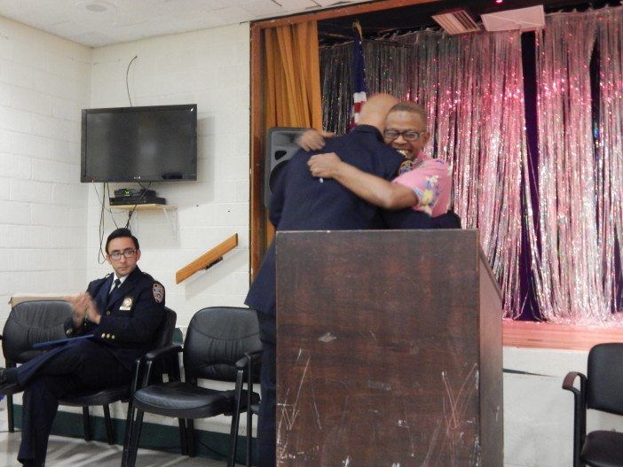 Former Executive Officer Anthony Sanseverino hugs Community Council President Ed Powell.