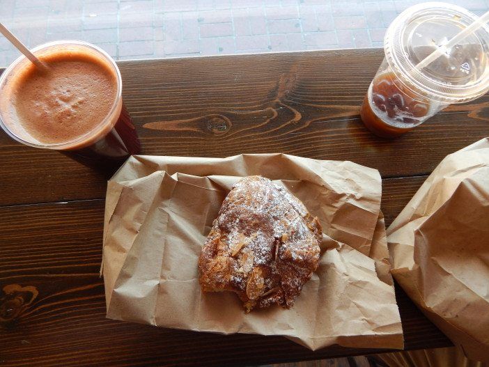 Our smoothie, cold brew iced coffee and almond croissant.