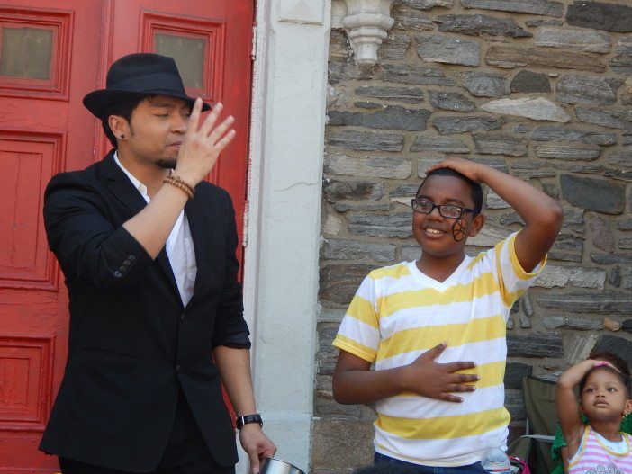 Flatbush Avenue Street Fair magician and kid