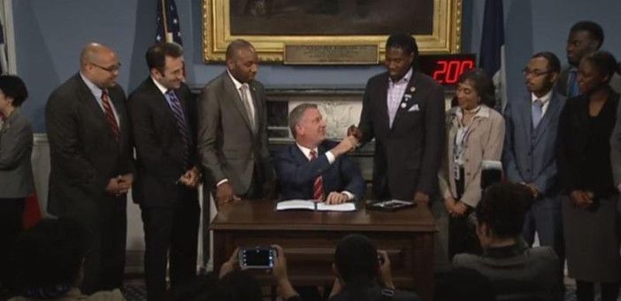 Today, Council Member Williams (center-right) joined Mayor de Blasio (center), the Council's Chair of Environmental Protections Donovan Richards (center-left) and others as the Mayor signed Williams' catch basin bill into law. Photo courtesy Councilman Jumaane Williams' office