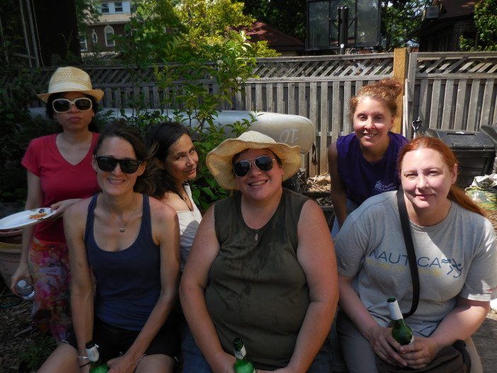 Church Avenue BID Executive Director Lauren Elvers Collins, top right, joins the crew at Q Gardens.