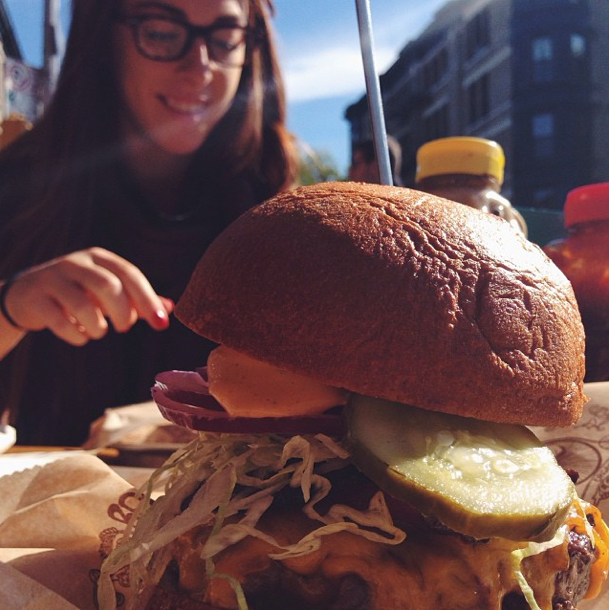 Massive burgers enjoyed in the sunshine at Bareburger. Photo by iansigmon.