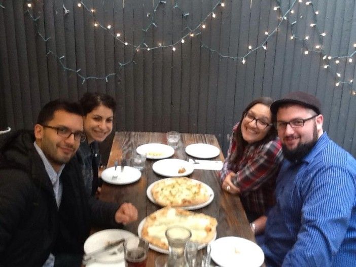 Diving into pizza in the great outdoors! Photo via Brooklyn Central.