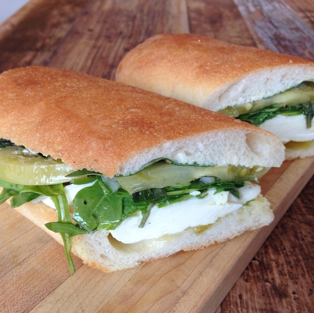 Marinated green tomatoes & mozzarella with fresh arugula & basil sandwich at BKLYN Larder (photo by BKLYN Larder)