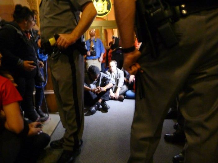 Councilman Jumaane Wiliams and other protesters surrounded by state police. Photo via the Flatbush Tenant Coalition