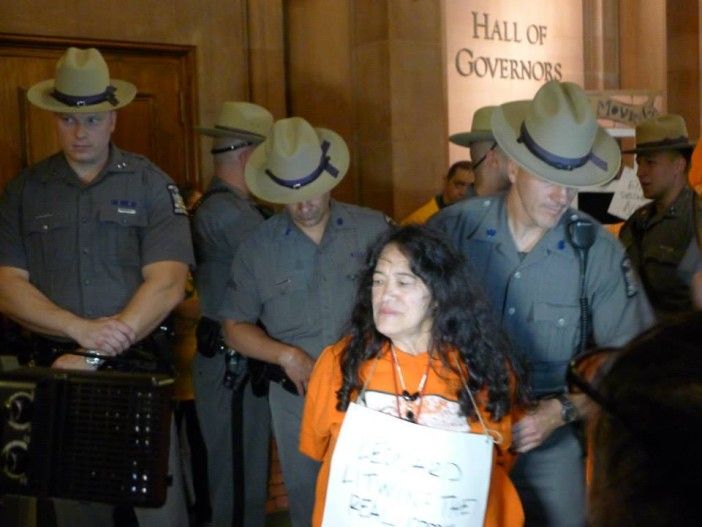 Another protester is led off by state police. Photo via the Flatbush Tenant Coalitilon