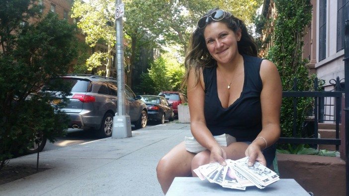 Xochitl Gonzalez reads tarot for neighbors outside her Fort Greene home. (Photo by Fort Greene Focus)