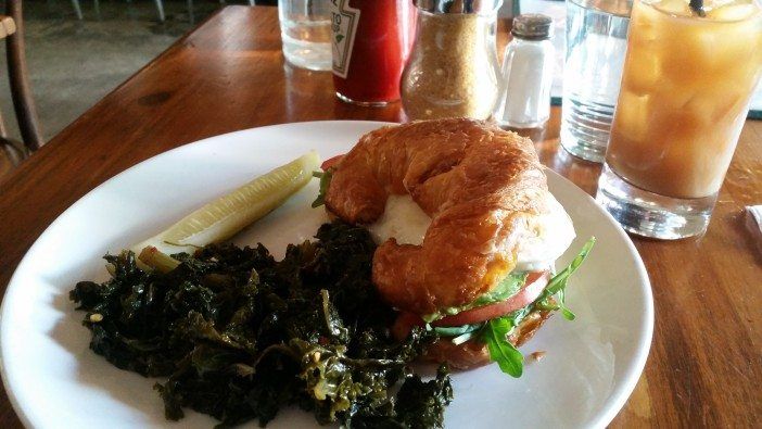 The Jessie sandwich with a side of kale and a pickle. (Photo by Fort Greene Focus)