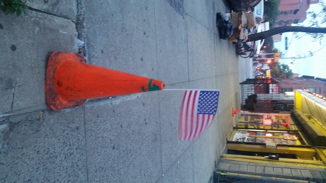 American flag in traffic cone