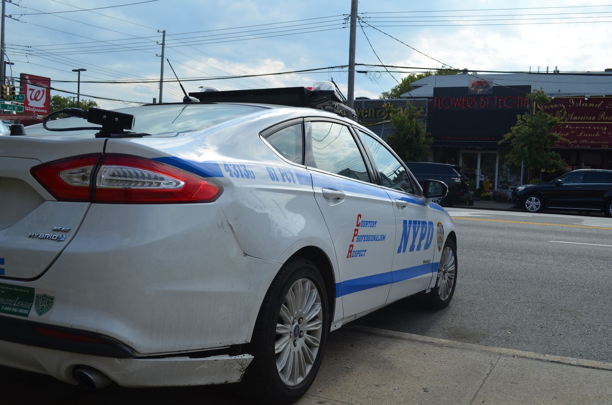 A police car outside the 61st Precinct.