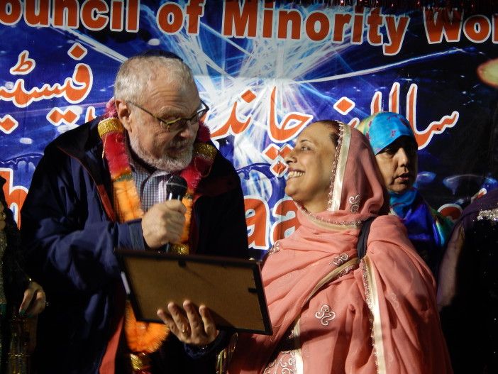 Eid Assemblyman Brennan's rep gives Volunteer of the Year award from American Council of Minority Women to Kaneez Fatima