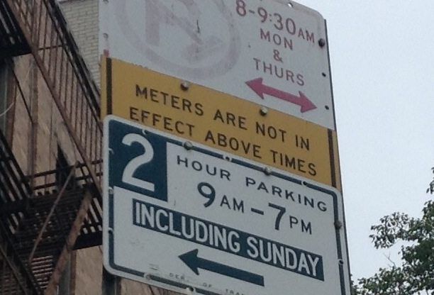 Although Sunday meter regulations were eliminated 10 years ago, two signs on Brighton 12th Street still claim the rules are in effect. 