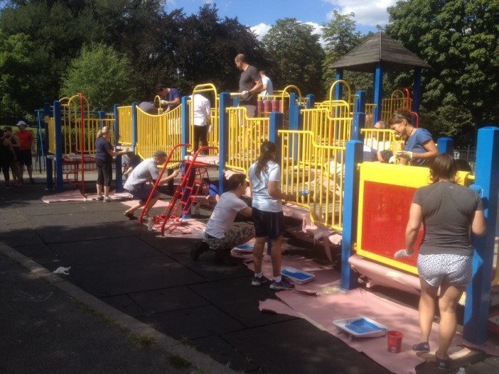 Volunteers paint the DeKalb Avenue playground in Fort Greene Park. (Photo by Fort Greene Park Conservancy)