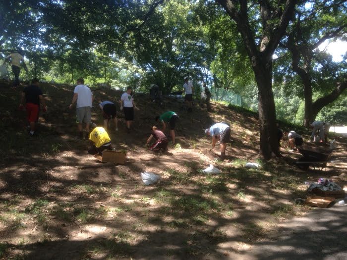 Volunteers paint the DeKalb Avenue playground in Fort Greene Park. (Photo by Fort Greene Park Conservancy)