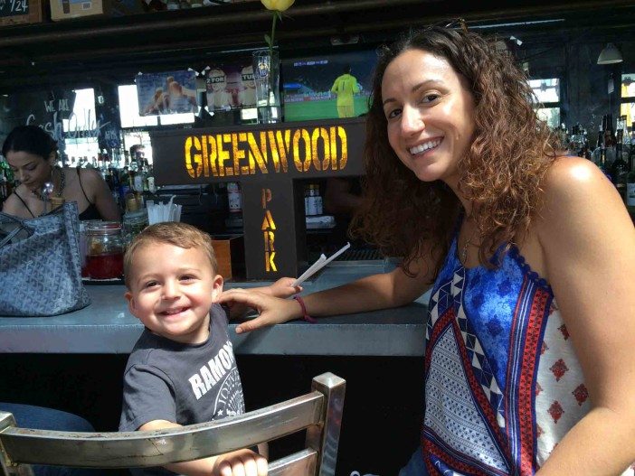A mother and child enjoy the bar at Greenwood Park in South Slope