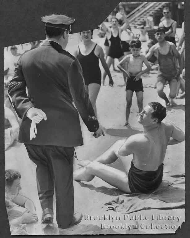 a cop tells a man on coney island to pull up his swimsuit