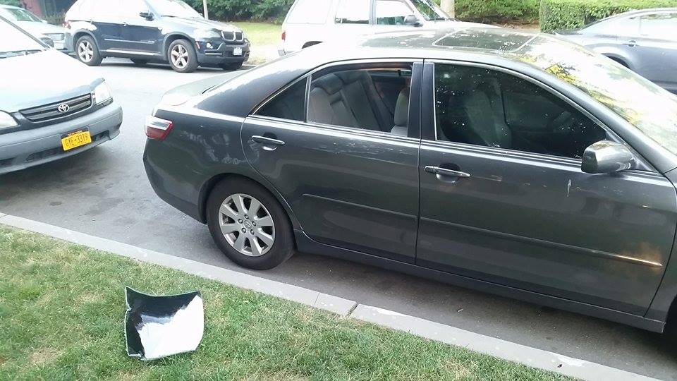 A neighbor spotted this car's smashed window on Albemarle Road. Photo by Kevin