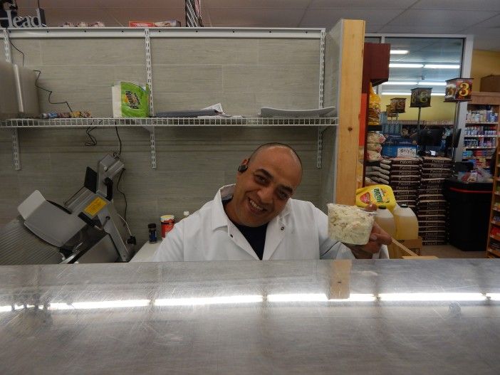 A Key Food employee shows off the goods at their full service deli. Photo by Ditmas Park Corner