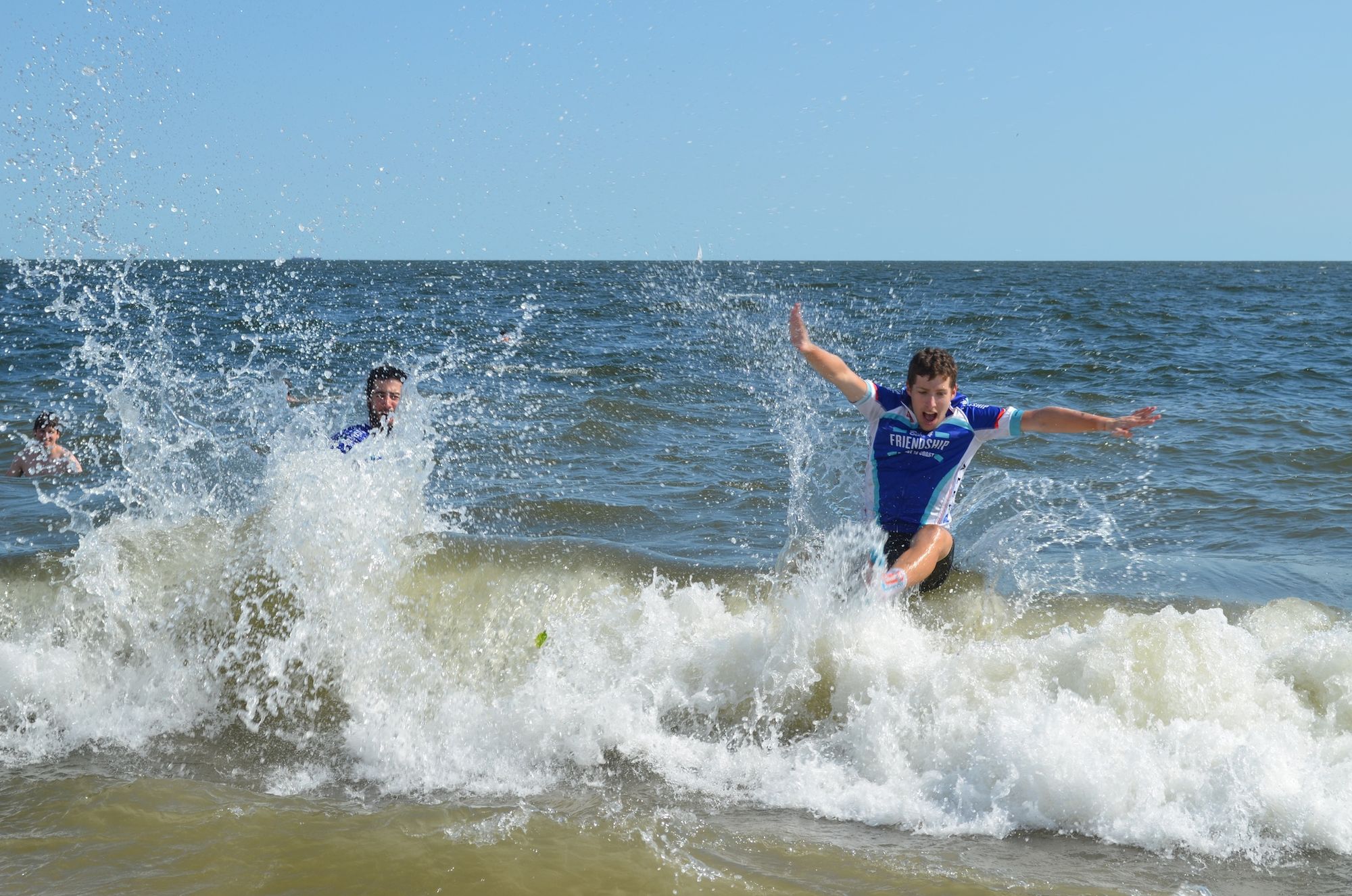 Members of the Bike 4 Friendship men's team jump into the ocean after completing their cross-country journey. 