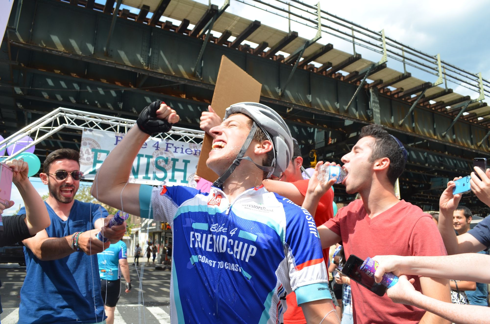 Ephraim Fruchter celebrates his first cross country bike trip. 