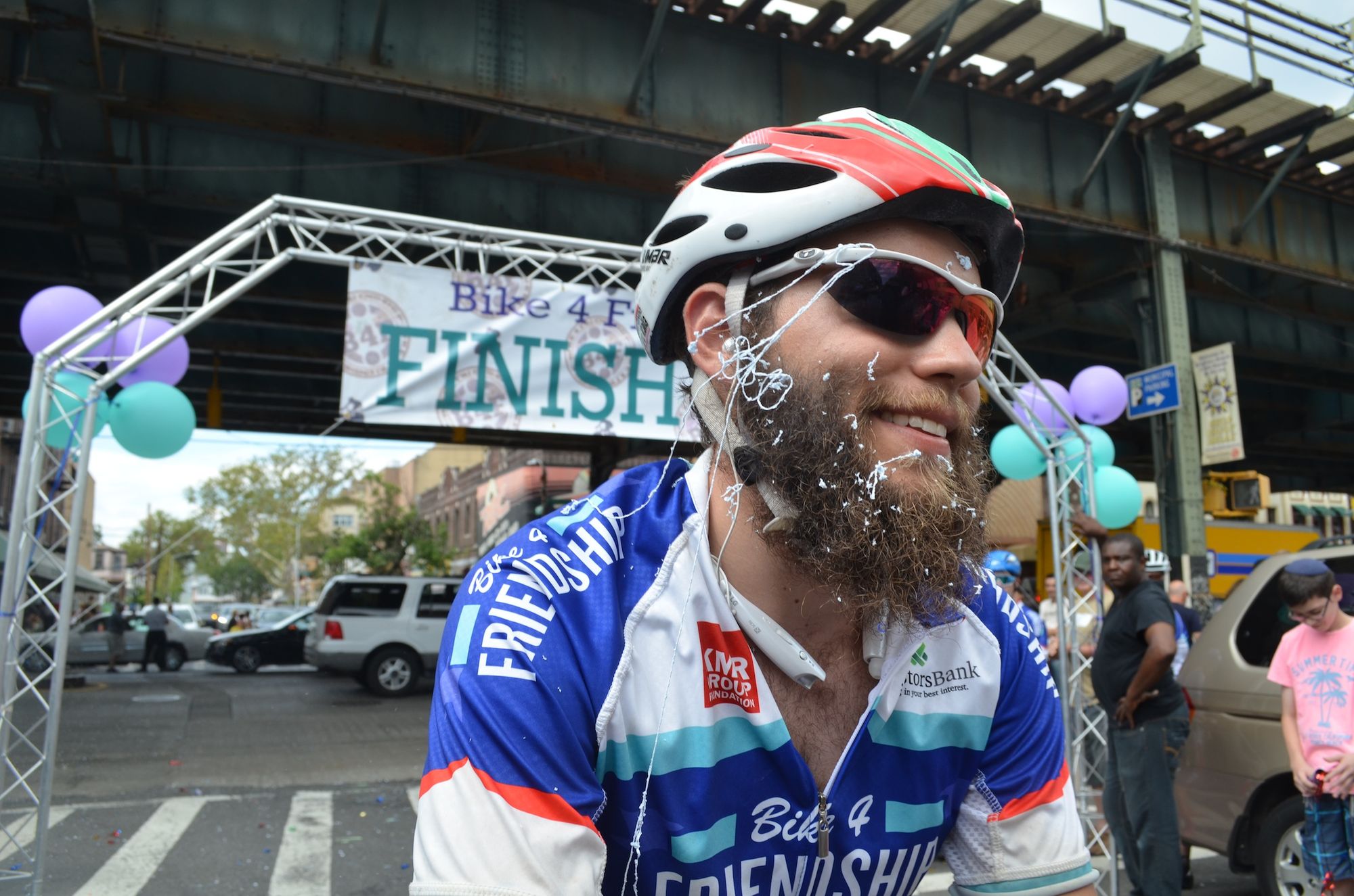 Yitzi Smith celebrates completing his third cross-country bike ride. 