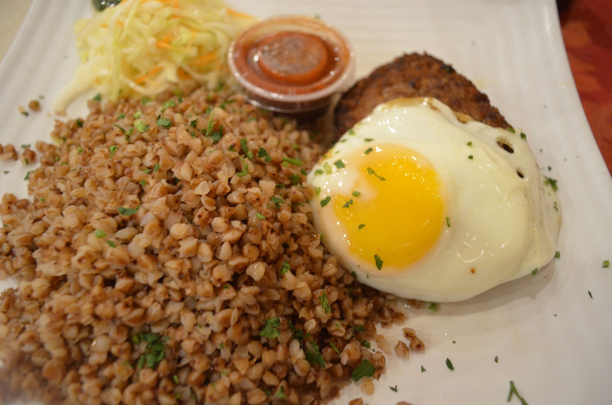 The meat schnitzel, with buckwheat, at Vanka Cafe. (Photo: Alex Ellefson / Sheepshead Bites)