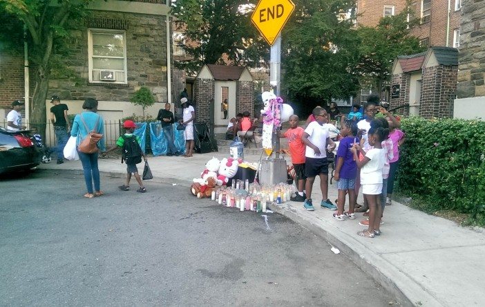 Children who played with Jadann on their dead-end street gather near a memorial set up for her. (Photo by Shannon Geis/Ditmas Park Corner)