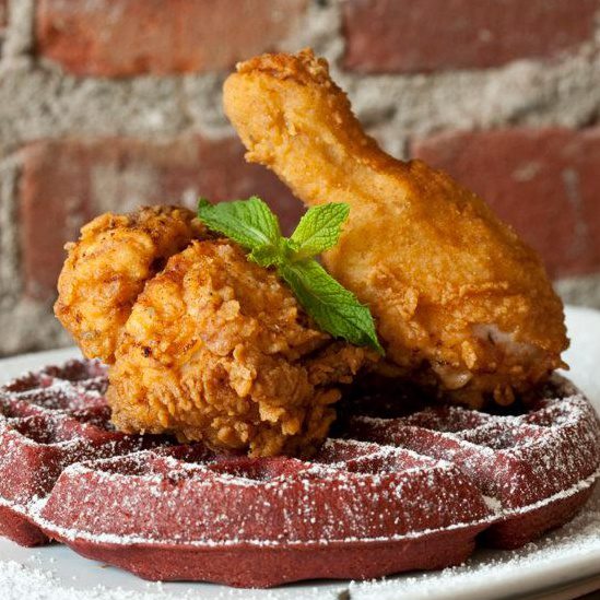 fried chicken on red velvet waffles at soco