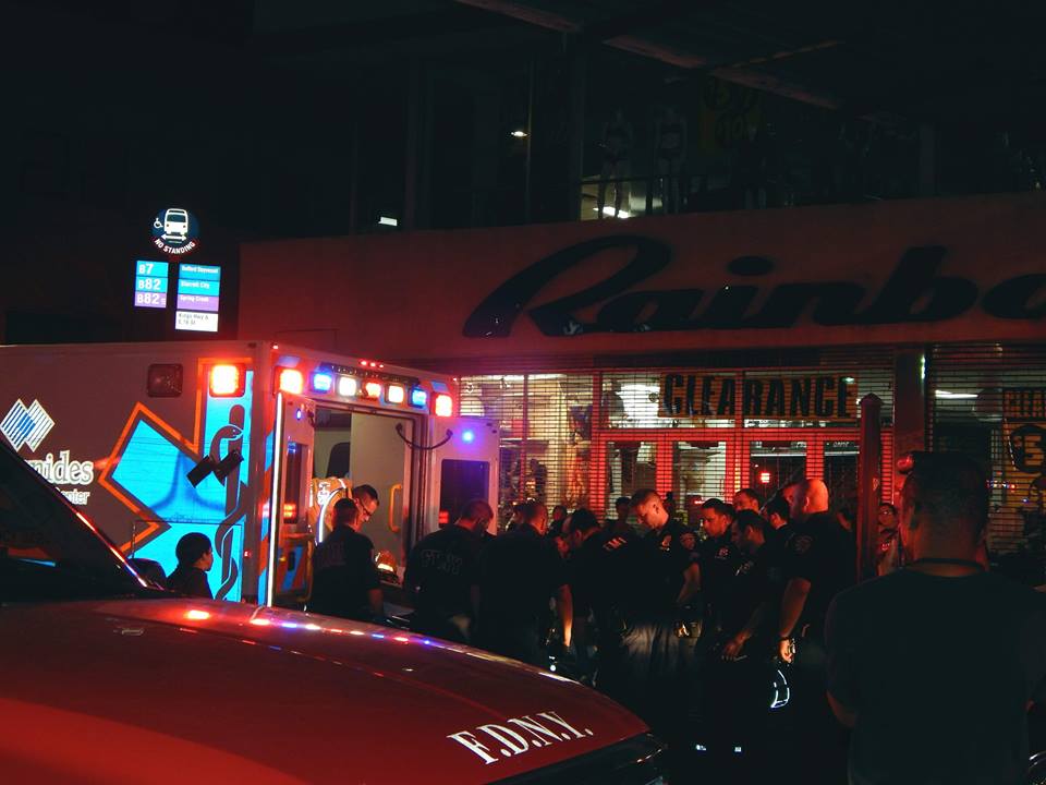 Emergency workers putting the injured man on an ambulance at the Kings Highway subway station.