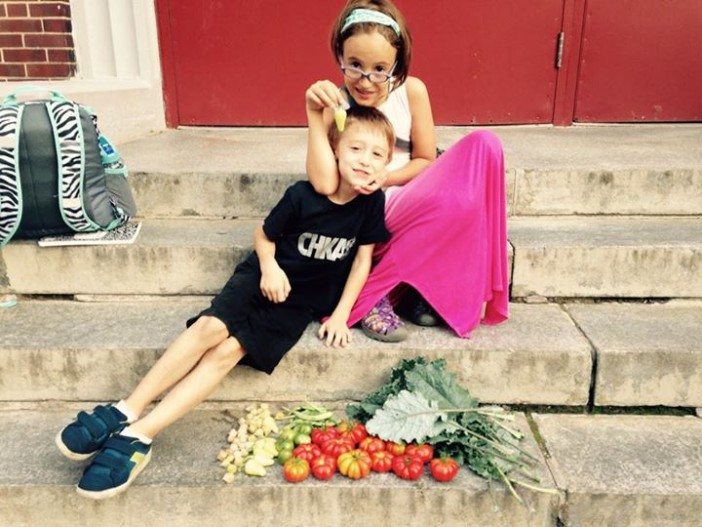 Nicholas Arnold and Laila Palmer with the latest PS 20 harvest. (Photo via Augusta Palmer.