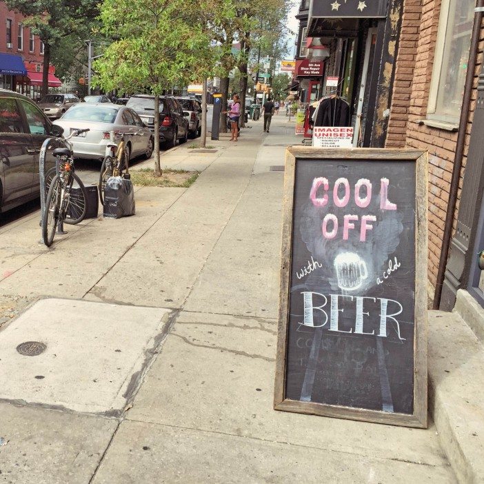 chalkboard that read 'cool off with a cold beer' in park slope