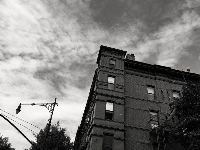 the sky over a building and lamppost in park slope